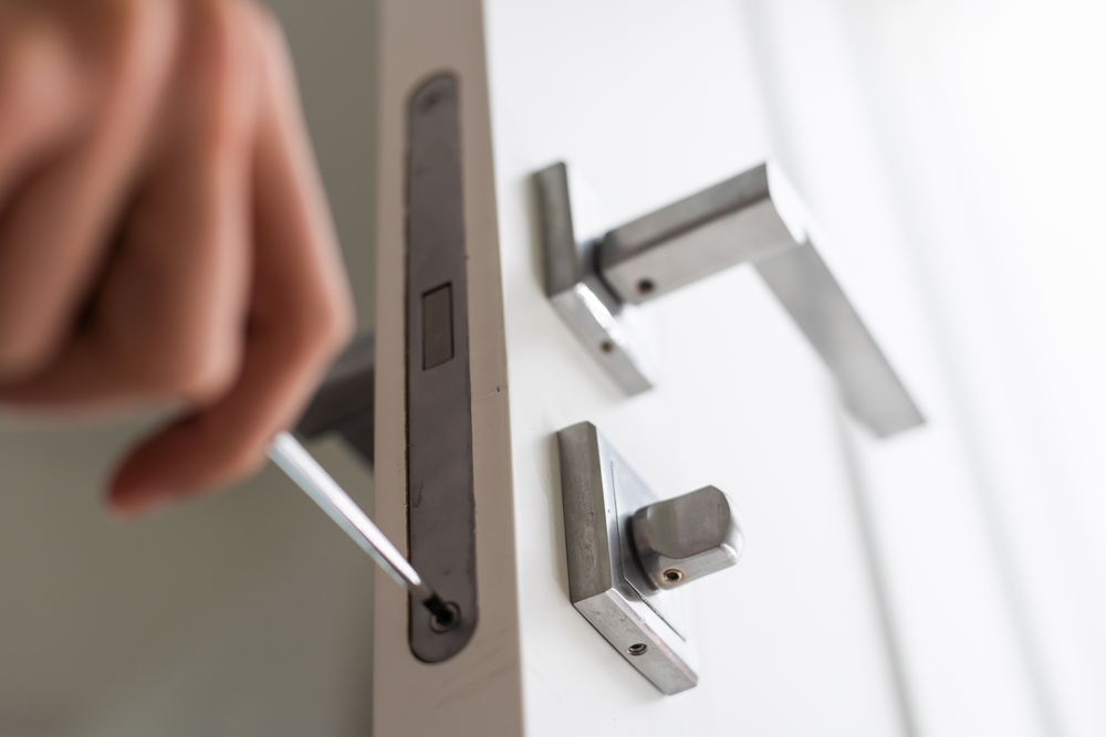 A,locksmith,is,repairing,an,interior,door,lock.,close Up,of