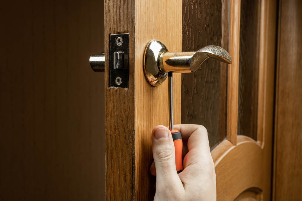 Handyman,fixing,or,repairing,apartment,wooden,door,lock.,home,furniture